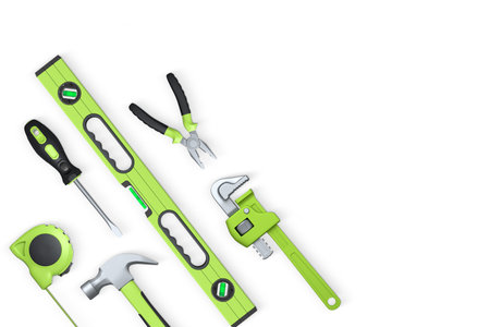 Various construction tools like hammer, pliers, screwdriver, and tape measure, isolated on white...
