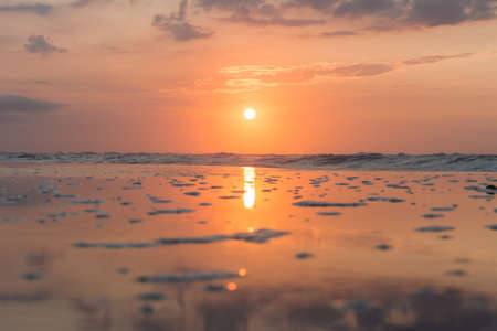 sunset beach . A beautiful sunset at the beach of the Mediterranean. Beautiful colors and sunsets on a sandy beach. Enjoy the sunset in the summer on the Mediterranean beachの写真素材