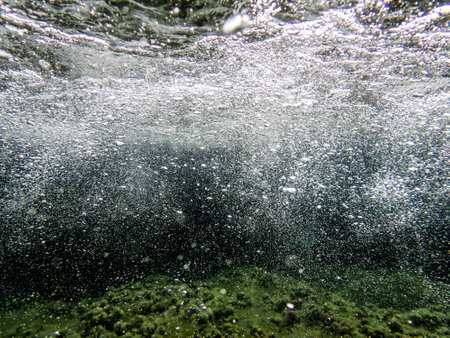 Underwater bubbles, under the Mediterranean sea, very suitable landscape picture for backgrounds, blue background of underwater bubbles. sea bubbles . Blue sea waves from underwater with bubbles.の写真素材