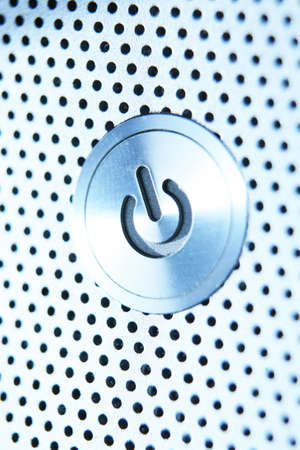 Power button silver, soft focused.