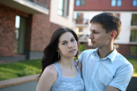 Couple in front of house.の写真素材