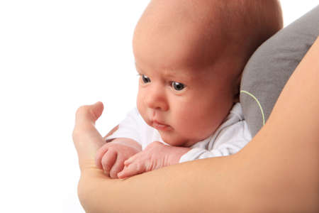 Little boy on mothers hands. Isolated on white background