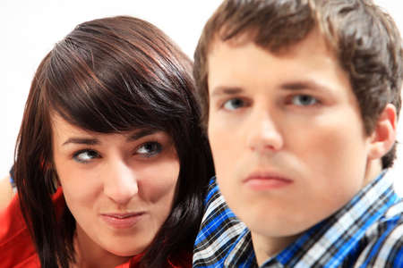 Young love couple smiling. Over white background