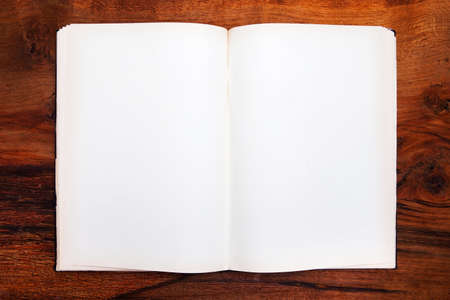 Open book on wooden table
