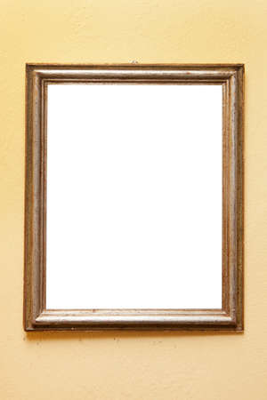 Image frame. Image holder hanging on a yellow wall