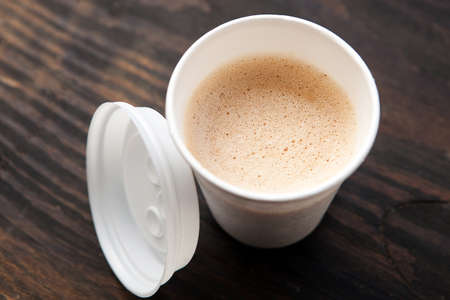 Disposable coffee cup on tableの写真素材