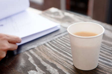 Disposable coffee cup on tableの写真素材