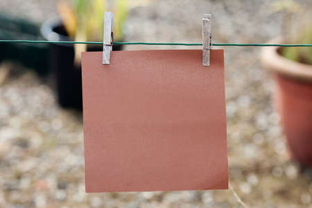 paper card hanging on string
