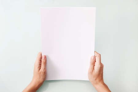 hands holding blank A4 copy space letterの写真素材