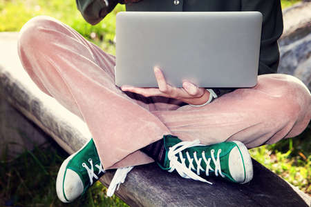 woman using computer in the parkの写真素材