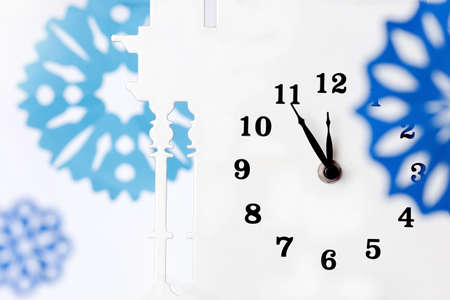 Paper snowflakes and clockの写真素材