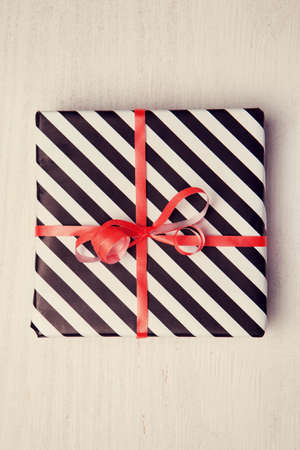 Gift on white wooden backgroundの写真素材