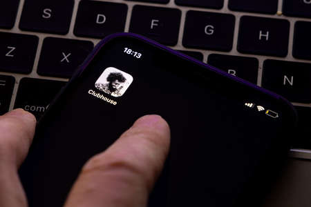Clubhouse application view on the smartphone, controversy 2021 that hides behind the Social app. Clubhouse drop in audio chat application view on the smartphoneのeditorial素材