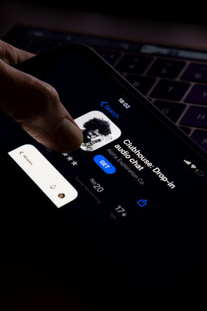 Clubhouse application view on the smartphone, controversy 2021 that hides behind the Social app. Clubhouse drop in audio chat application view on the smartphoneのeditorial素材