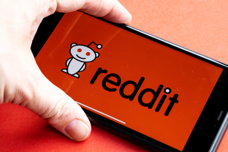 Reddit is a social news aggregation, web content, and discussion website. Registered members submit content to the site. Reddit logo on iPhone 11のeditorial素材