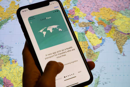 Vaccination, disease immunity passport, health and surveillance concepts. Smartphone displaying a valid digital vaccination certificate for COVID-19.のeditorial素材