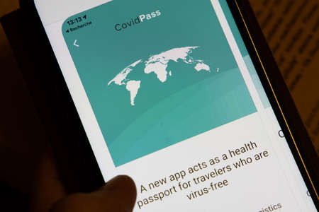 Vaccination, disease immunity passport, health and surveillance concepts. Smartphone displaying a valid digital vaccination certificate for COVID-19.のeditorial素材