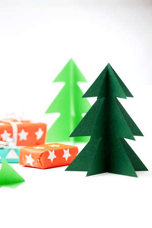 Christmas tree and gifts on a white background. Christmas and New Year concept.の写真素材