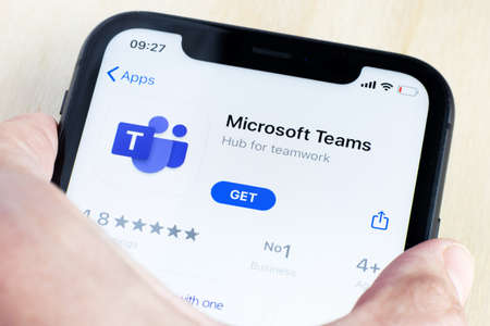 Microsoft Teams messenger application icon on Apple iPhone X screen close-up. Microsoft Teams...