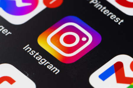 Instagram application icon on Apple iPhone screen close-up. Instagram is a photo-sharing social...