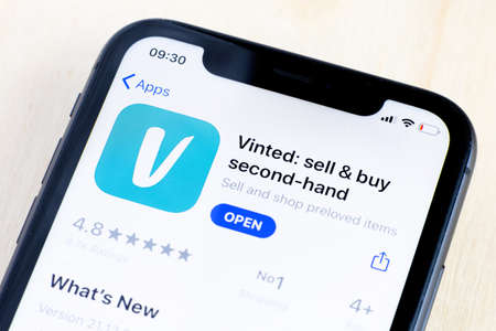 Vinted mobile app icon on Apple iPhone screen close-up.の写真素材