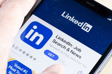 Linkedin application icon on smartphone screen close-up. Linkedin app icon. Linkedin application....