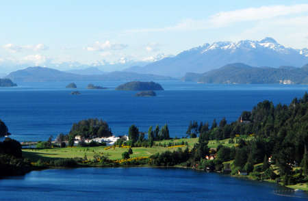 paradise country house on a lake near mountainsの写真素材