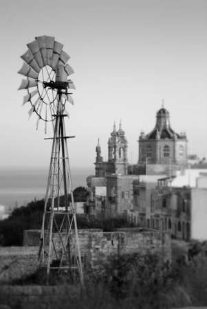 Windmill view with church in background. Island of Gozo, Malta, Europe.の写真素材