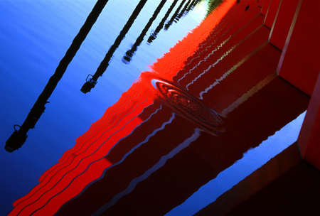 Reflection in water of architectural detailの写真素材