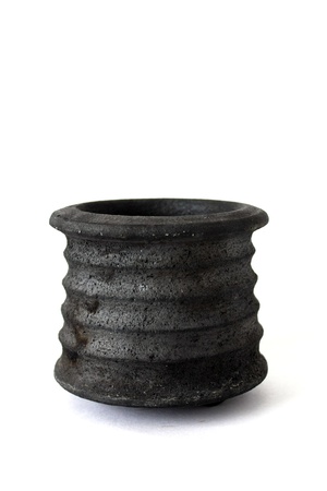Rough ceramic boul isolated on whiteの写真素材