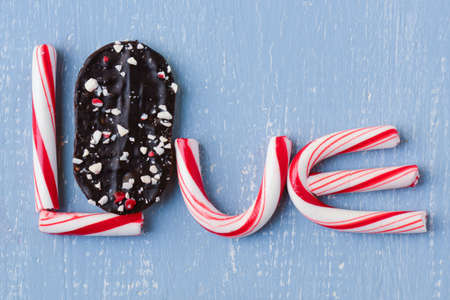 Candy Cane and Peppermint Cookie Spelling the word loveの写真素材