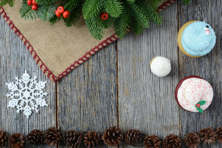 Holiday Cupcakes On Rustic Wood Background for the Holidaysの写真素材