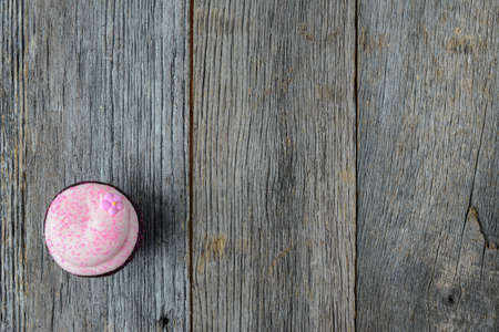 Cupcake on  Dark Wooden Backgroundの写真素材