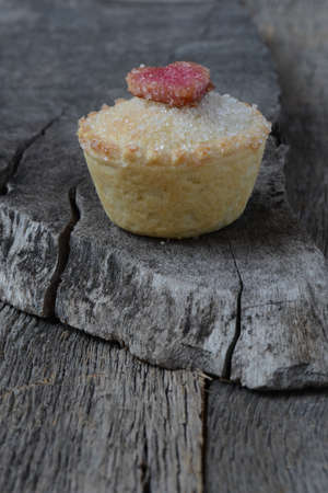 Black Berry Pie Cupcake with Heart and Sugar Topping on Wooden Backgroundの写真素材
