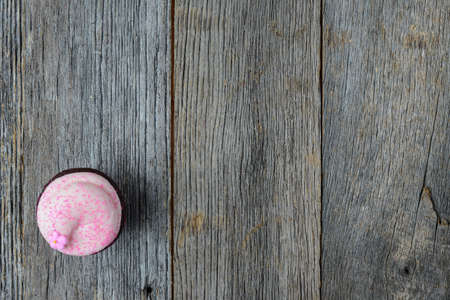 Cupcake on  Dark Wooden Backgroundの写真素材
