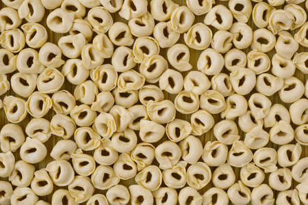 Flush Tortellini with Spaghetti on Full Backgroundの写真素材