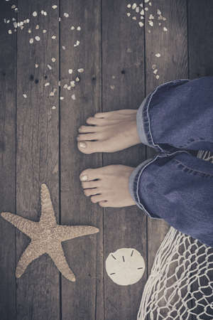 Feet. First-Person view  on rustic wood Floor background.の写真素材