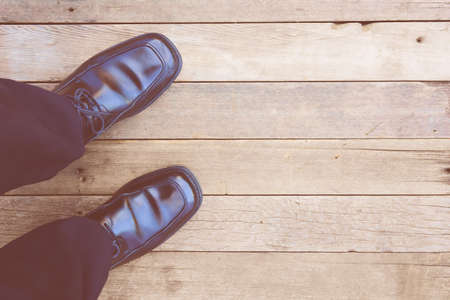Feet. First-Person view  on rustic wood Floor background.の写真素材