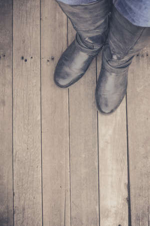 Feet. First-Person view  on rustic wood Floor background.