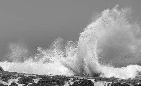 Big Ocean waves crashing into rocks and explodingの写真素材