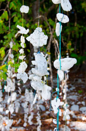 Windbell shell mobile  over ocean in Thailandの写真素材