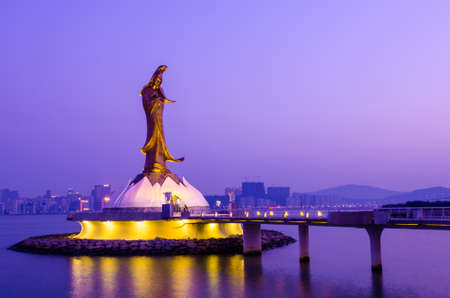 Statue of Kun Iam in the evening, the goddess of mercy, landmark of Macauの写真素材