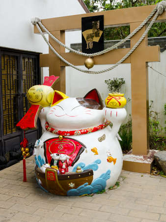 HONG KONG - MARCH 28  Lucky Cat, Ngong Ping Village, Lantau Island, Hong Kong on March 28, 2014  Part of popular wishing tree that is richly adorned with the wishes of countless visitorsのeditorial素材