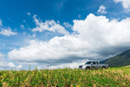 one vehicle pickup of the hill with blue sky.の写真素材
