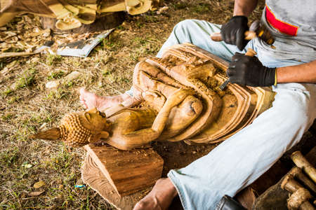 Traditional craftsman carving woodの写真素材