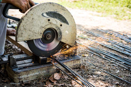 worker cutting steel rodの写真素材