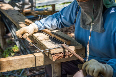 Workers bending steel for use in construction.の写真素材