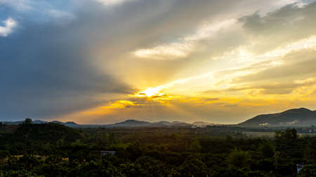 Colorful sunset over the mountain hillsの写真素材
