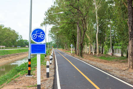 Bicycle road sign on asphalt.