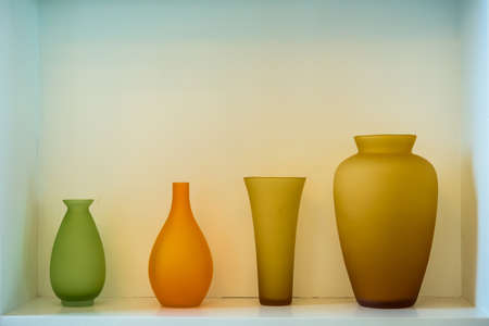 Beautiful Colorful glass bottles on shelfの写真素材